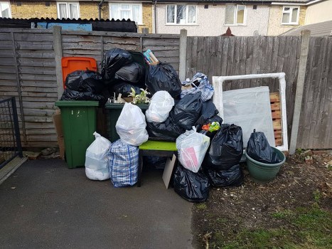 Waste removal truck navigating Limehouse streets